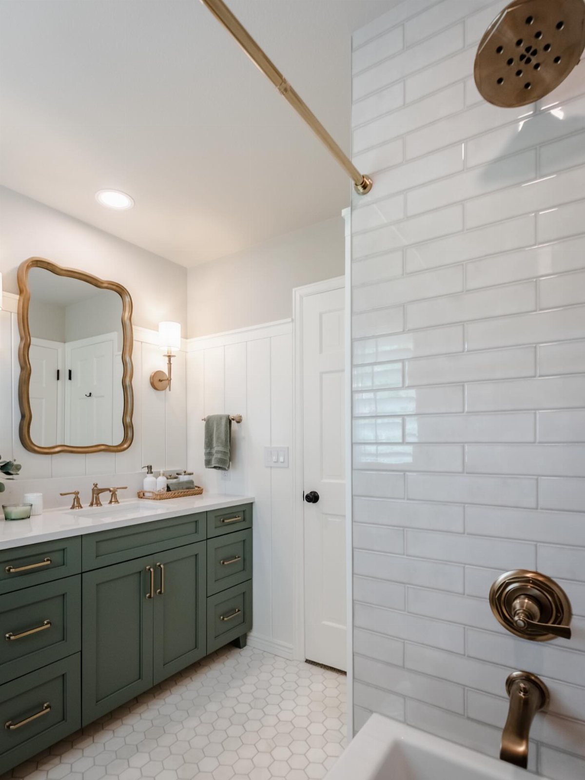 White beadboard wainscoting installed on the walls of a modern bathroom with green vanity.